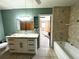 Updated bathroom featuring a modern vanity, tub, and tiled shower at 612 Shore Rd, Nokomis, FL 34275