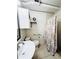Bathroom showcasing a pedestal sink, toilet, and shower with updated fixtures at 612 Shore Rd, Nokomis, FL 34275
