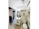 Bathroom showcasing a vanity with storage, toilet, and accessible features, designed for comfort and functionality at 612 Shore Rd, Nokomis, FL 34275