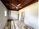 Bedroom view highlighting wood ceilings and natural light, enhanced by a ceiling fan and an attached bathroom at 612 Shore Rd, Nokomis, FL 34275