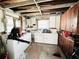 Functional utility room with washer, dryer, and ample storage cabinets at 612 Shore Rd, Nokomis, FL 34275
