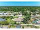 Aerial view of a home with a spacious backyard and a private, fenced-in yard at 7420 Tuttle Ave, Sarasota, FL 34243