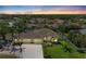 Aerial view of a home with a well-manicured lawn and mature trees in a residential neighborhood at 7420 Tuttle Ave, Sarasota, FL 34243