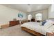 Spacious bedroom offers plenty of room and natural light with an array of windows at 7420 Tuttle Ave, Sarasota, FL 34243