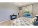 Relaxing bedroom with a ceiling fan and sliding glass door to a pool at 7420 Tuttle Ave, Sarasota, FL 34243