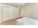 Bedroom featuring carpet flooring, closet space, and a comfortable bed at 7420 Tuttle Ave, Sarasota, FL 34243