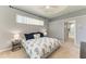 Relaxing bedroom with soft lighting, a ceiling fan, and an attached bathroom at 7420 Tuttle Ave, Sarasota, FL 34243