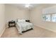 Comfortable bedroom featuring a ceiling fan, carpet flooring, and a window with blinds at 7420 Tuttle Ave, Sarasota, FL 34243