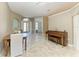 Dining room with tile flooring, lots of natural light, and an open entryway at 7420 Tuttle Ave, Sarasota, FL 34243