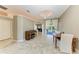 Bright dining room with tile floors and views of the outdoor patio at 7420 Tuttle Ave, Sarasota, FL 34243