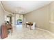 Bright dining room with tile flooring and a view of the patio and backyard at 7420 Tuttle Ave, Sarasota, FL 34243