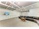 Finished garage boasts recessed lighting, sectional sofa and built in storage cabinets at 7420 Tuttle Ave, Sarasota, FL 34243