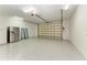 Bright garage features epoxy floors, steel shelving, and lots of storage at 7420 Tuttle Ave, Sarasota, FL 34243