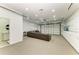 Finished garage with comfortable seating and built-in cabinets at 7420 Tuttle Ave, Sarasota, FL 34243
