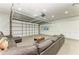 Finished garage boasts recessed lighting, sectional sofa and built in storage cabinets at 7420 Tuttle Ave, Sarasota, FL 34243