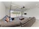 Finished garage boasts recessed lighting, sectional sofa, and built in storage cabinets at 7420 Tuttle Ave, Sarasota, FL 34243