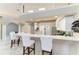 Well-designed kitchen with stainless steel appliances, granite countertops and bar seating at 7420 Tuttle Ave, Sarasota, FL 34243