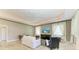 Cozy living room with natural light and a ceiling fan at 7420 Tuttle Ave, Sarasota, FL 34243