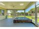 Back patio including a built-in hot tub, perfect for relaxation at 7420 Tuttle Ave, Sarasota, FL 34243