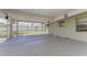 Covered patio provides an ideal outdoor living space with a screen and view of the backyard at 7420 Tuttle Ave, Sarasota, FL 34243