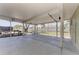 A screened-in patio offers outdoor space for relaxing and grilling with a view of the yard at 7420 Tuttle Ave, Sarasota, FL 34243