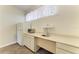 Convenient wet bar features a sink, counter space, and cabinets, great for entertaining at 7420 Tuttle Ave, Sarasota, FL 34243