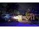 Inviting home exterior at twilight, showcasing manicured landscaping and illuminated facade at 7582 Camden Harbour Dr, Bradenton, FL 34212
