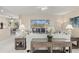 Bright living room with comfortable seating, stylish decor, and a sliding glass door offering great views at 7582 Camden Harbour Dr, Bradenton, FL 34212