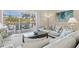 Comfortable living room with neutral colors, plush seating, and an open layout leading to outdoor living spaces at 7582 Camden Harbour Dr, Bradenton, FL 34212