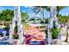 Welcoming waterfront entrance with decorative arches, checkered pathway, palm trees, and a view of the marina at 7582 Camden Harbour Dr, Bradenton, FL 34212