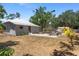 Aerial view showcasing the spacious backyard with seating area and fire pit perfect for outdoor gatherings at 815 Hand Ave, Sarasota, FL 34232