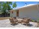 Home featuring a brick patio with outdoor seating, perfect for entertaining at 815 Hand Ave, Sarasota, FL 34232