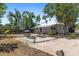 Exterior of home featuring a patio area and well-maintained landscaping in the backyard at 815 Hand Ave, Sarasota, FL 34232
