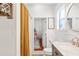 Bathroom features shower, modern vanity and a peek into an adjoining room at 815 Hand Ave, Sarasota, FL 34232