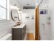 Bright bathroom features double vanity, stylish mirrors and subway tiled shower and floors at 815 Hand Ave, Sarasota, FL 34232