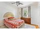 Bedroom features a wooden dresser, natural light and decorative headboard at 815 Hand Ave, Sarasota, FL 34232