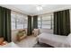 Charming bedroom with a bed, multiple windows, and a play area at 815 Hand Ave, Sarasota, FL 34232