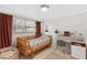 Charming bedroom with a cozy bed, ample natural light, a beanbag chair, and a stylish desk area at 815 Hand Ave, Sarasota, FL 34232