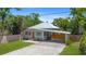 Charming single Gathering home with a metal roof, carport and fenced yard at 815 Hand Ave, Sarasota, FL 34232