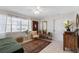 This light and airy living room showcases tiled floors and a quaint area rug at 815 Hand Ave, Sarasota, FL 34232
