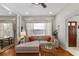 Bright living room with hardwood floors and natural light from large windows at 815 Hand Ave, Sarasota, FL 34232