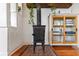 View of the wood stove and shelving in a bright living space at 815 Hand Ave, Sarasota, FL 34232