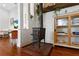 Wood stove situated in a living room featuring hardwood floors at 815 Hand Ave, Sarasota, FL 34232