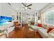 Open-concept living space with hardwood floors seamlessly connecting to the kitchen at 815 Hand Ave, Sarasota, FL 34232