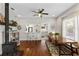 Open living space featuring a wood stove, dining area, and kitchen at 815 Hand Ave, Sarasota, FL 34232