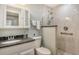 Well-appointed bathroom featuring a granite countertop vanity, toilet, and walk-in shower at 9470 High Gate Dr # 2213, Sarasota, FL 34238