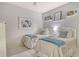 Well-lit bedroom with twin beds, stylish decor, and a serene atmosphere for a restful night at 9470 High Gate Dr # 2213, Sarasota, FL 34238