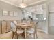 Dining area with a round table, adjacent to the kitchen, perfect for casual meals at 9470 High Gate Dr # 2213, Sarasota, FL 34238