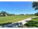 Beautiful view of the well-maintained golf course, lush greenery, and clear blue skies at 9470 High Gate Dr # 2213, Sarasota, FL 34238