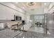 Bright kitchen featuring granite countertops, stainless steel appliances, and access to outdoor patio at 9470 High Gate Dr # 2213, Sarasota, FL 34238